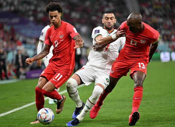 (221201) -- DOHA, Dec. 1, 2022 -- Hakim Ziyech (C) of Morocco vies with Tajon Buchanan (L) and Atiba Hutchinson of Canada during their Group F match at the 2022 FIFA World Cup, WM, Weltmeisterschaft, Fussball at Al Thumama Stadium in Doha, Qatar, Dec. 1, 2022. ) (SP)QATAR-DOHA-2022 WORLD CUP-GROUP F-CAN VS MAR XinxYuewei 