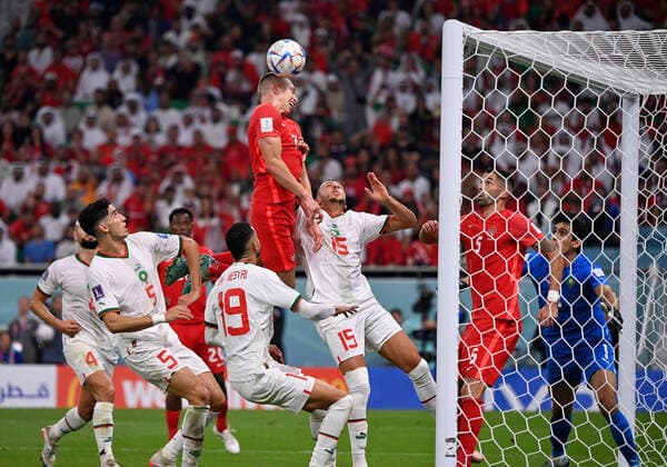 (221201) -- DOHA, Dec. 1, 2022 -- Alistair Johnston (top) of Canada heads for the ball during the Group F match between Canada and Morocco at the 2022 FIFA World Cup, WM, Weltmeisterschaft, Fussball at Al Thumama Stadium in Doha, Qatar, Dec. 1, 2022. ) (SP)QATAR-DOHA-2022 WORLD CUP-GROUP F-CAN VS MAR ChenxCheng 