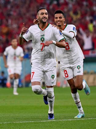 (221201) -- DOHA, Dec. 1, 2022 -- Hakim Ziyech (L) of Morocco celebrates after scoring during the Group F match between Canada and Morocco at the 2022 FIFA World Cup, WM, Weltmeisterschaft, Fussball at Al Thumama Stadium in Doha, Qatar, Dec. 1, 2022. ) (SP)QATAR-DOHA-2022 WORLD CUP-GROUP F-CAN VS MAR ChenxCheng 