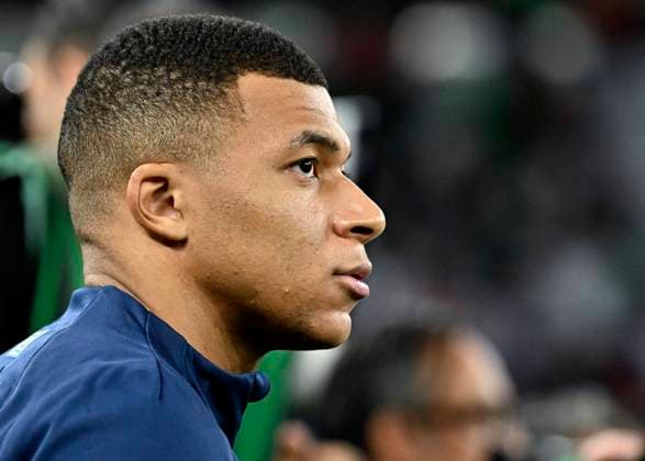 (221204) -- DOHA, Dec. 4, 2022 -- Kylian Mbappe of France looks on prior to the Round of 16 match between France and Poland of the 2022 FIFA World Cup, WM, Weltmeisterschaft, Fussball at Al Thumama Stadium in Doha, Qatar, Dec. 4, 2022. ) (SP)QATAR-DOHA-2022 WORLD CUP-ROUND OF 16-FRA VS POL XiaoxYijiu 