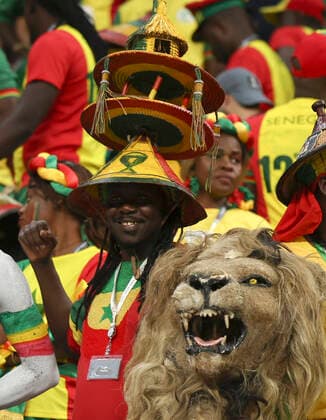 (221204) -- AL KHOR, Dec. 4, 2022 -- Fans of Senegal cheer prior to the Round of 16 match between England and Senegal of the 2022 FIFA World Cup, WM, Weltmeisterschaft, Fussball at Al Bayt Stadium in Al Khor, Qatar, Dec. 4, 2022. ) (SP)QATAR-AL KHOR-2022 WORLD CUP-ROUND OF 16-ENG VS SEN PanxYulong 