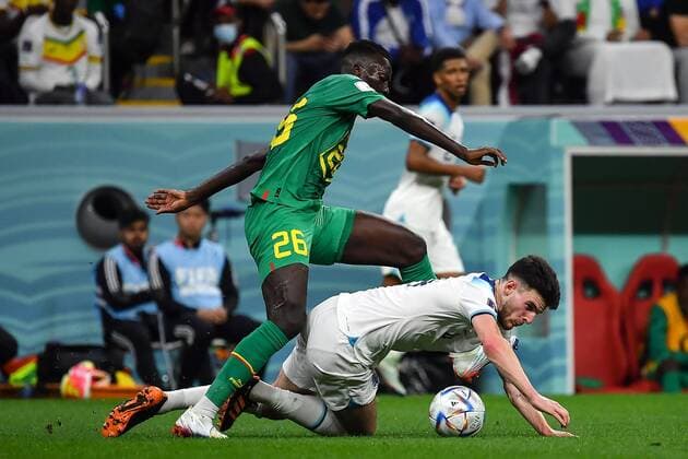 RECORD DATE NOT STATED FIFA World Cup, WM, Weltmeisterschaft, Fussball Qatar 2022 England vs Senegal OF (L-R), Pape Gueye of Senegal and Declan Rice of England during the game England vs Senegal, corresponding to the round of 16 of the FIFA World Cup Qatar 2022, at Al Bayt Stadium, Al Khor, Doha, on December 04, 2022. <br><br> (I-D), Pape Gueye de Senegal y Declan Rice de Inglaterra durante el partido Inglaterra vs Senegal, correspondiente a los octavos de final de la Copa Mundial de la FIFA Catar 2022, en el Estadio Al Bayt, Al Khor, Doha, el 04 de Diciembre de 2022 AL KHOR DOHA QATAR  Copyright: xIsaacxOrtizx 20221204_4030