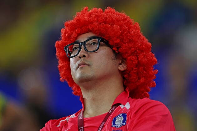 5th December 2022; Stadium 974, Ras Abu Aboud, Doha, Qatar: FIFA World Cup, WM, Weltmeisterschaft, Fussball final 16 round, Brazil versus South Korea: Fan of South Korea in head dress  ActionPlus12456260 HeulerxAndrey Content restricted for UK based newspaper
