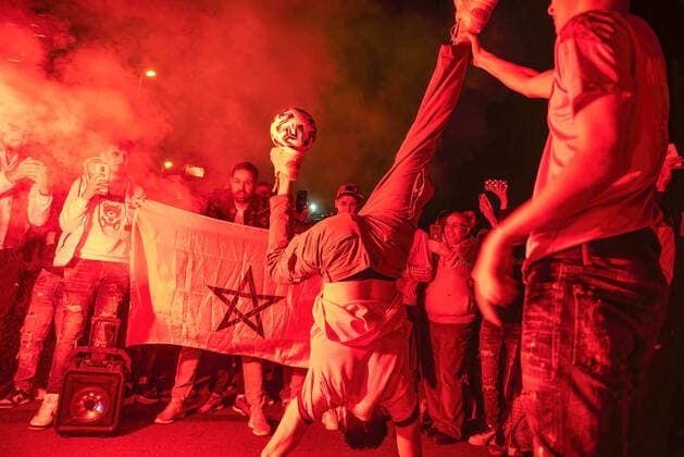 December 6, 2022, Barcelona, Spain: A group of young Moroccans celebrate with pyrotechnics, dancing and ball control on Las Ramblas in Barcelona after the penalty shootout victory that knocked Spain out of the World Cup in Qatar. Barcelona Spain - ZUMAs197 0196182502st Copyright: xXimenaxBorrazasx
