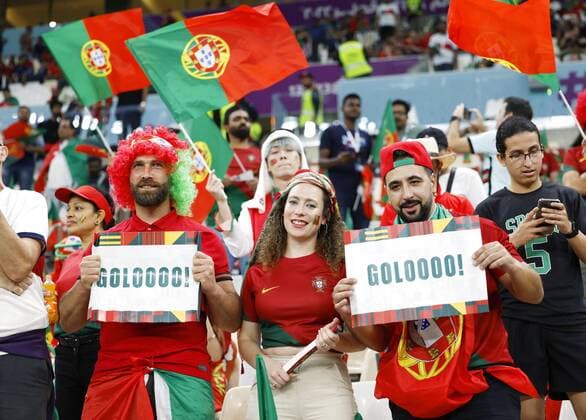 Football World Cup in Qatar Supporters dressed in the colors of the Portuguese flag wait for the start of a World Cup round of 16 football match between Portugal and Switzerland at Lusail Stadium in Lusail, Qatar, on Dec. 6, 2022.  A14AA0001372074P 