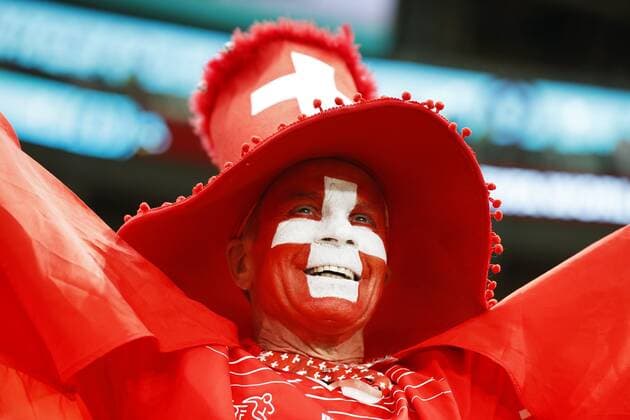 Football World Cup in Qatar A fan with a Swiss flag painted on his face waits for the start of a World Cup round of 16 football match between Portugal and Switzerland at Lusail Stadium in Lusail, Qatar, on Dec. 6, 2022.  A14AA0001372075P 