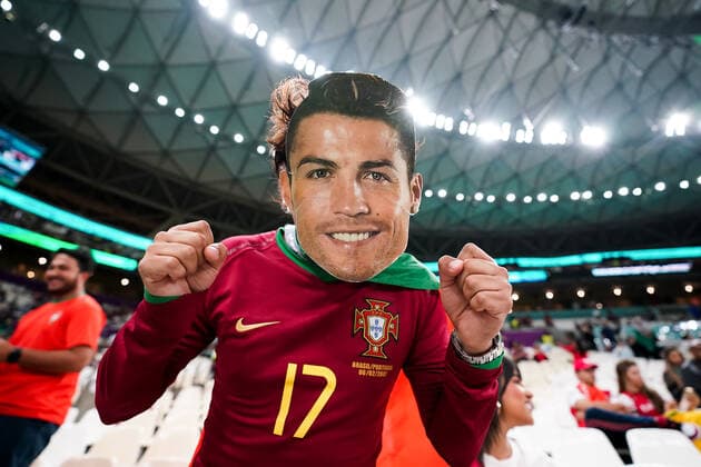 DOHA, QATAR - DECEMBER 6: Supporter of Portugal with a Cristiano Ronaldo mask poses for a photo before the FIFA World Cup, WM, Weltmeisterschaft, Fussball Qatar 2022 Round of 16 match between Portugal and Switzerland at Lusail Stadium on December 6, 2022 in Lusail, Qatar. (Photo by Florencia Tan Jun PxImages Icon Sportswire) SOCCER: DEC 06 FIFA World Cup - Switzerland v Portugal Icon2212061468