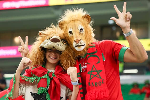 (221210) -- DOHA, Dec. 10, 2022 -- Fans of Morocco pose for photos before the Quarterfinal between Morocco and Portugal of the 2022 FIFA World Cup, WM, Weltmeisterschaft, Fussball at Al Thumama Stadium in Doha, Qatar, Dec. 10, 2022. ) (SP)QATAR-DOHA-2022 WORLD CUP-QUARTERFINAL-MAR VS POR LanxHongguang 