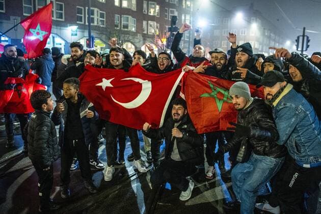 AMSTERDAM - Moroccan football supporters celebrate the 1-0 win of the Moroccan football team on the Mercatorplein in Amsterdam during the match between Morocco and Portugal at the World Cup in Qatar. ANP OLAF KRAAK xVIxANPxSportx xxANPxIVx *** AMSTERDAM Moroccan football supporters celebrate the 1 0 win of the Moroccan football team on the Mercatorplein in Amsterdam during the match between Morocco and Portugal at the World Cup in Qatar ANP OLAF KRAAK xVIxANPxSportx xxANPxIVx 459211224 originalFilename: 459211224.jpg