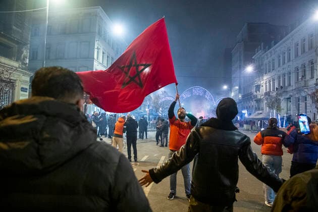 Illustration picture shows Moroccan supporters celebrating their victory in the center of Brussels, after winning the quarter final game between Morocco and Portugal, at the FIFA 2022 World Cup, on Saturday 10 December 2022. NICOLASxMAETERLINCK  x55718775x