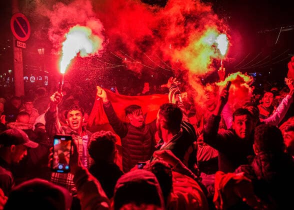 December 10, 2022, Barcelona, Spain: Morocco football supporters lit the smoky flame to celebrate the winning over Portugal in the 2022 FIFA World Cup, WM, Weltmeisterschaft, Fussball at Las Ramblas. The Moroccan national soccer team makes history by qualifying for the semifinals of the World Cup in Qatar. Madness breaks out in the streets of Barcelona, where the Moroccan community is one of the most numerous in the city. The supporters celebrated without incident. Barcelona Spain - ZUMAs197 20221210_zaa_s197_330 Copyright: xMarioxCollx