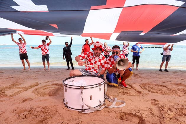 QATAR 2022 - Croatian fans unfurled a 200m long flag on the beach in front of the Hilton Doha Hotel Croatian fans unfurled a 200m long flag on the beach in front of the Hilton Doha Hotel to support the national team, Nationalteam before the semi-final match against Argentina at the World Cup in Qatar, in Doha, Qatar, on December 13, 2022, IgorxKralj PIXSELL