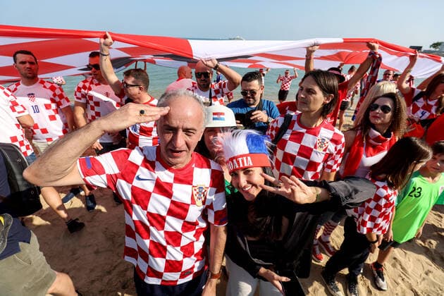 QATAR 2022 - Croatian fans unfurled a 200m long flag on the beach in front of the Hilton Doha Hotel Croatian fans unfurled a 200m long flag on the beach in front of the Hilton Doha Hotel to support the national team, Nationalteam before the semi-final match against Argentina at the World Cup in Qatar, in Doha, Qatar, on December 13, 2022, IgorxKralj PIXSELL