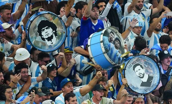 Mandatory Credit: Photo by Javier Garcia Shutterstock (13661834fg) Argentina fans celebrate the third goal holding up Diego Maradona and Lionel Messi drums Argentina v Croatia, FIFA World Cup, WM, Weltmeisterschaft, Fussball 2022, Semi Final, Football, Lusail Stadium, Al Daayen, Qatar - 13 Dec 2022 Editorial Use Only Argentina v Croatia, FIFA World Cup 2022, Semi Final, Football, Lusail Stadium, Al Daayen, Qatar - 13 Dec 2022 Editorial Use Only  Copyright: xJavierxGarcia Shutterstockx 13661834fg
