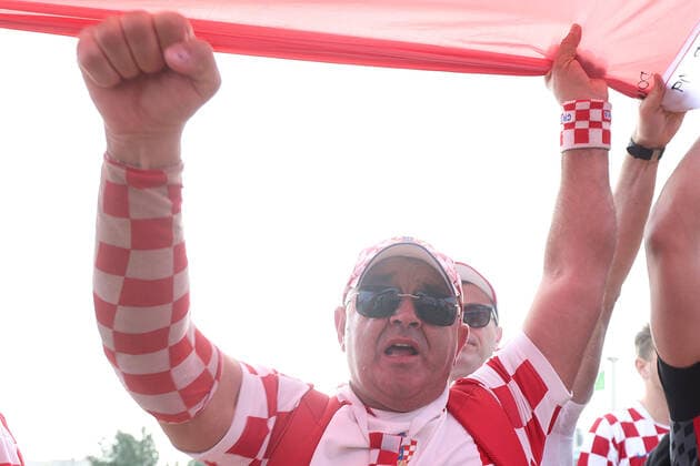 Croatia fans carry 200 meters flag Supporters of Croatia are seen prior FIFA World Cup, WM, Weltmeisterschaft, Fussball Qatar 2022 bronze medal match between Croatia and Morocco at Hilton Doha beach in Doha, Qatar on December 17, 2022. Fans carry 200 meters long flag of Croatia. GoranxStanzl PIXSELL