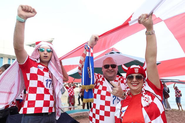 Croatia fans carry 200 meters flag Supporters of Croatia are seen prior FIFA World Cup, WM, Weltmeisterschaft, Fussball Qatar 2022 bronze medal match between Croatia and Morocco at Hilton Doha beach in Doha, Qatar on December 17, 2022. Fans carry 200 meters long flag of Croatia. GoranxStanzl PIXSELL
