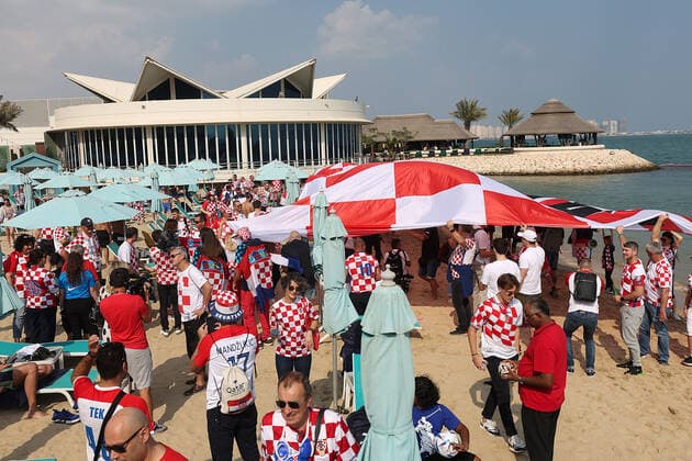 Croatia fans carry 200 meters flag Supporters of Croatia are seen prior FIFA World Cup, WM, Weltmeisterschaft, Fussball Qatar 2022 bronze medal match between Croatia and Morocco at Hilton Doha beach in Doha, Qatar on December 17, 2022. Fans carry 200 meters long flag of Croatia. GoranxStanzl PIXSELL