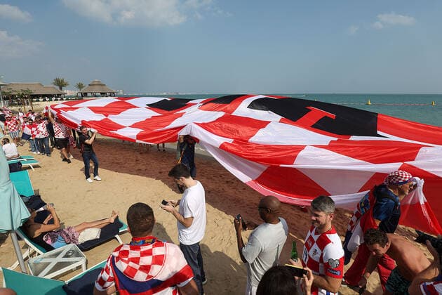 Croatia fans carry 200 meters flag Supporters of Croatia are seen prior FIFA World Cup, WM, Weltmeisterschaft, Fussball Qatar 2022 bronze medal match between Croatia and Morocco at Hilton Doha beach in Doha, Qatar on December 17, 2022. Fans carry 200 meters long flag of Croatia. GoranxStanzl PIXSELL