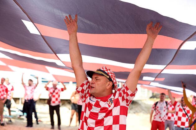 Croatia fans carry 200 meters flag Supporters of Croatia are seen prior FIFA World Cup, WM, Weltmeisterschaft, Fussball Qatar 2022 bronze medal match between Croatia and Morocco at Hilton Doha beach in Doha, Qatar on December 17, 2022. Fans carry 200 meters long flag of Croatia. GoranxStanzl PIXSELL