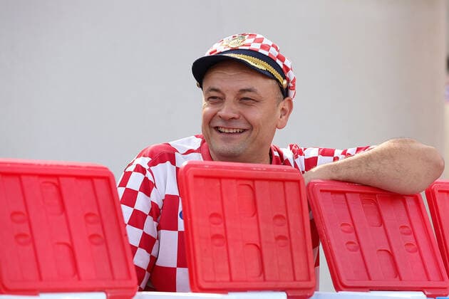 Croatia fans carry 200 meters flag Supporters of Croatia are seen prior FIFA World Cup, WM, Weltmeisterschaft, Fussball Qatar 2022 bronze medal match between Croatia and Morocco at Hilton Doha beach in Doha, Qatar on December 17, 2022. Fans carry 200 meters long flag of Croatia. GoranxStanzl PIXSELL