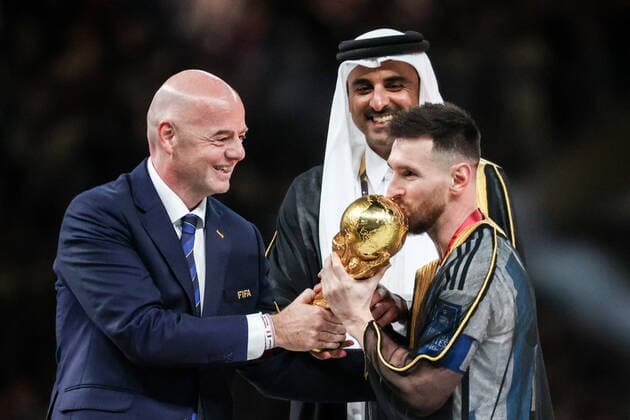 QATAR, LUSAIL - DECEMBER 18, 2022: FIFA president Gianni Infantino, Argentina captain Lionel Messi (L-R front) and Emir of Qatar Tamim bin Hamad Al Thani are seen during the trophy ceremony for the 2022 FIFA World Cup, WM, Weltmeisterschaft, Fussball final football match between Argentina and France at Lusail Iconic Stadium. Argentina won 3-3 (4-2) in a penalty shootout. Sergei Bobylev TASS  56487409