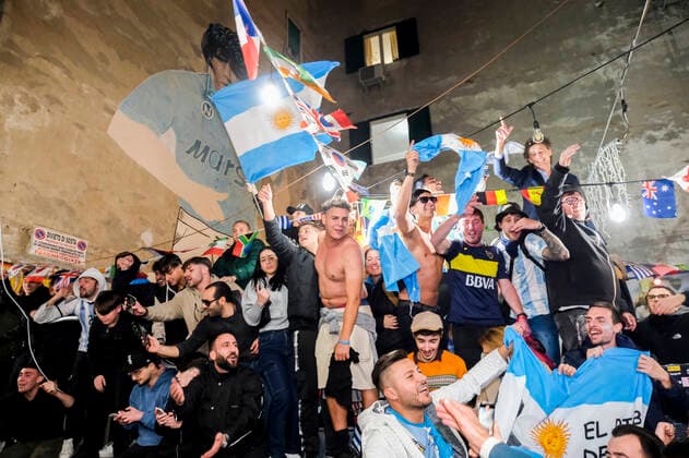 the argentinean celebration victory wolrd cup in naples Argentina world champion in Naples the Argentinean community together with Neapolitans celebrate the victory of the selection under the historic mural of Diego Armando Maradona in the Spanish quarters ABPH7118 Copyright: xAntonioxBalascox