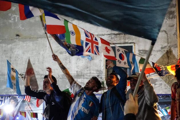 December 18, 2022, NAPOLI: Neapolitan supporters of Argentina celebrate the victory of the Argentina national soccer team at the Qatar World Cup under the Maradona mural in the Spanish Quarters, in Naples, Italy, 18 December 2022. .ANSA CESARE ABBATE Mondiali: Napoli festeggia l’Argentina campione del mondo  - ZUMAa110 20221218_zaf_a110_030 Copyright: xCesarexAbbatex