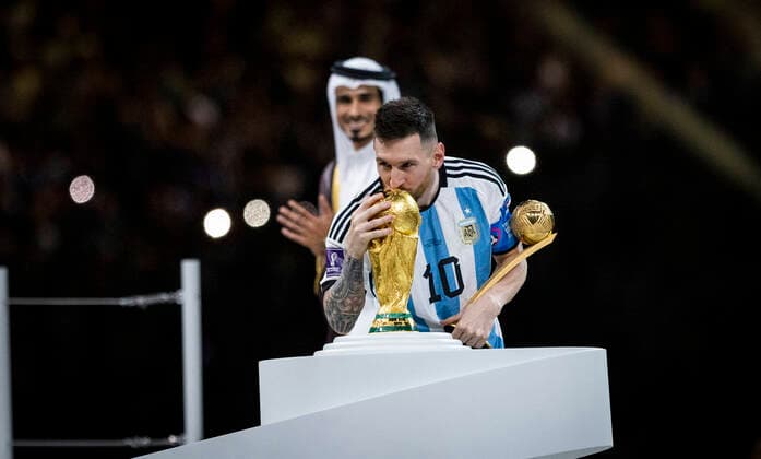 Doha, Qatar. 18th Dec, 2022. Lionel Messi (Arg) with his best player trophy kisses World Cup 2022 trophy Argentina - France Final Match Argentinien - Frankreich World Cup 2022 in Qatar 18.12.2022