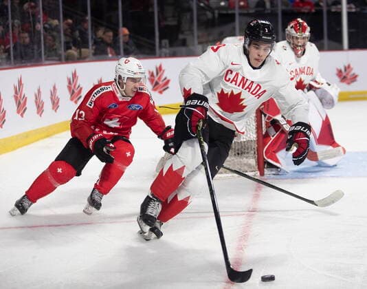 December 19, 2022, Moncton, NB, Canada: Switzerland™s Louis Robin chases Canada™s Olen Zellweger during third period IIHF World Junior Hockey Championship pre-tournament hockey action in Moncton, N.B., on Monday, Dec. 19, 2022. Canada News - December 19, 2022  - ZUMAc35_ 20221219_zaf_c35_068 Copyright: xRonxWardx