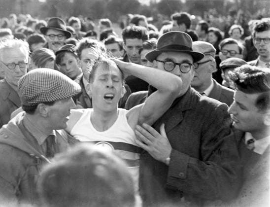 Roger Bannister at the conclusion of his record breaking sub four minute mile world record. While gasping for breath, he is aided by Frank Stampel ( Checked Cap). The time was 3 min 59.4 secs.6th May 1954 Great Britain  Copyright: xTopFotox 0012417