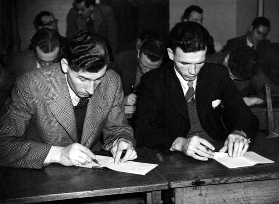 Crystal Palace Business classes for London footballers. Crystal Palace players take up textiles. Many well-known footballers are taking part in the courses of business training organised by the Football Association, with the ain of fitting pro-footballers with jobs for work, other than football! At present the plan only covers London and the south, but it will extend to other areas in time. Courses being held at the London School of Distributive Trades and includes textiles, confectionery, book-keeping and grocery etc. Photo shows: Two members of the Crystal Palace FC seen as they study their course of textiles at the London school. (l-r) Bumstead and Farrington. 2nd November 1948 Great Britain  Copyright: xTopFotox 0552152