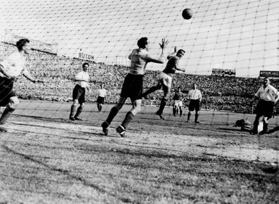 Italy v England Italy v England in Turin The England football team beat Italy by 4-0. The Italians cheered the brilliant England team, whose victory restored British prestige abroad. England defend their goal, while the Italian left-wing, Carapellese is on the ground. The centre forward, Guglielmo Gabetto heads for the goal. The English goalkeeper jumps but one of his defenders clears the ball. 18th May 1948 Italy  Copyright: xTopFotox 0586989