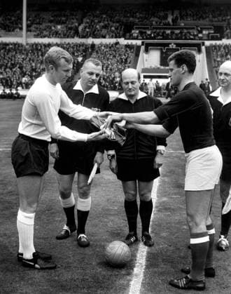 England v Hungary England v Hungary Bobby Moore exchanges pennants with Ferenc Sipos the Hungarian captain before the match watched by referee P Schwinte of France. 5th May 1965 Great Britain  Copyright: xTopFotox 0586997