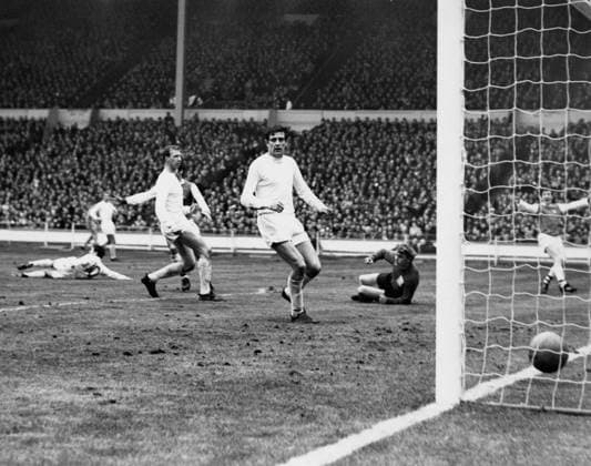 1968 League Cup Final 1968 League Cup Final Leeds United v Arsenal George Armstrong (Arsenal) raises his arms after his shot beats the Leeds goalkeeper and defence and enters the net, but the referee disallows the goal for a foul on Leeds player, Johnny Giles (on ground to the left). 2nd March 1968 Great Britain  Copyright: xTopFotox 0587354