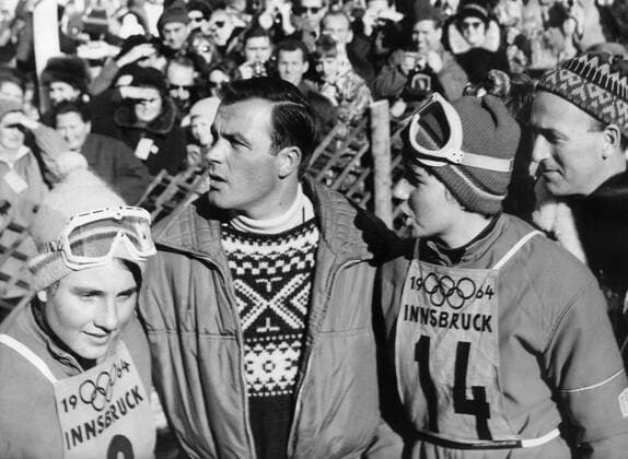 1964 Winter Olympic Games, Olympische Spiele, Olympia, OS 1964 Winter Olympic Games - Innsbruck, Austria Austrian ski legend Toni Sailer with the Goitschel sisters of France after the Giant Slalom event. Marielle Goitschel won the gold medal in the Giant Slalom and the silver medal in the Slalom and Christine Goitschel (no. 14) won the gold medal in the Slalom and the silver medal in the Giant Slalom.. 3 February 1964 TopFoto Austria  Copyright: xTopFotox 0944410