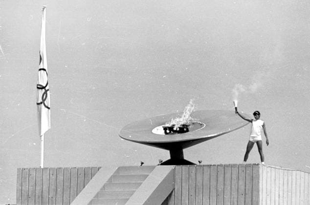 1968 Olympic Games, Olympische Spiele, Olympia, OS Mexico City: High above the Olympic Stadium the Mexican hurdler, Enriqueta Basilo de Sotelo, lights the flame for the 1968 Olympics. She is the first woman in the history of the modern Olympics to have the honour. The ceremony signalled the start of the games on October 12. 15 October 1968 Mexico  Copyright: xTopFotox 1104747
