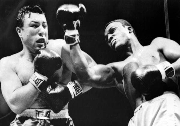 Joe Frazier Joe Frazier (right) misses a right to the head of Canadian heavyweight George Chuvalo during the first round of their scheduled 12-round contest . Frazier won with a technical knockout when the referee stopped the contest in the fourth round . 20th July 1967 United States  Copyright: xTopFotox 1285543