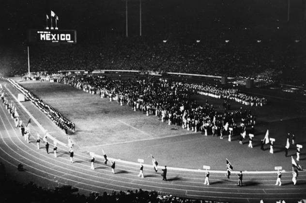 Closing Ceremony Olympic Games, Olympische Spiele, Olympia, OS The scoreboard says We meet again in Mexico City , 1968 , as the flags of the participating nations leave the national stadium at the end of the closing ceremonies of the XVIII Olympiad . 25th October 1964 Japan  Copyright: xTopFotox UPI487332