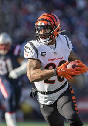 Cincinnati Bengals running back Joe Mixon (28) runs the ball during the first half of a game against the New England Patriots at Gillette Stadium in Foxborough, Massachusetts on Saturday, December 24, 2022.  BOS20221224101