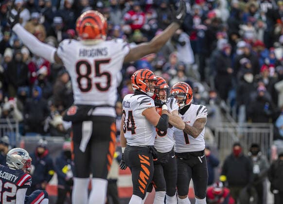 Cincinnati Bengals wide receiver Trenton Irwin (16) is congratulated by teammates Samaje Perine (34) and Ja Marr Chase (1) on his touchdown during the first half of a game at Gillette Stadium in Foxborough, Massachusetts on Saturday, December 24, 2022.  BOS20221224105