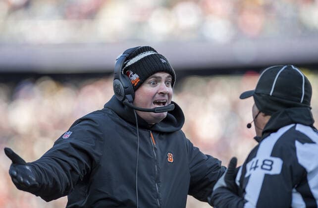 Cincinnati Bengals head coach Zac Taylor talks to down Judge Jim Mello (48) during the first half of a game at Gillette Stadium in Foxborough, Massachusetts on Saturday, December 24, 2022.  BOS20221224106