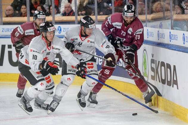26.12.2022, Davos, Eisstadion Davos, Spengler Cup: HC Sparta Praha - Team Canada, Tobie Paquette Bisson of Team Canada and Jonathan Ang of Team Canada against Michal Moravcik of Sparta Prague Davos Eisstadion Davos Graubünden Switzerland Copyright: xJustPictures.ch AndreaxBrancax