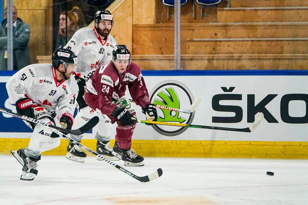DAVOS, SWITZERLAND - DECEMBER 26: David Desharnais of Team Canada (L) against Tomas Tomek of Sparta Prague during the match between HC Sparta Praha and Team Canada at Hockey Club Davos on December 26, 2022 in Davos, Switzerland. Davos Graubunden Switzerland Copyright: xJustPictures.ch JarixPestelaccix