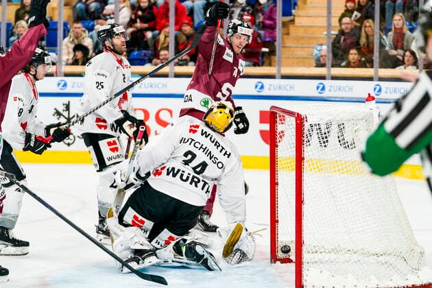 DAVOS, SWITZERLAND - DECEMBER 26: Daniel Pribyl of Sparta Prague celebrates his goal in front of goalkeeper Michael Hutchinson of Team Canada during the match between HC Sparta Praha and Team Canada at Hockey Club Davos on December 26, 2022 in Davos, Switzerland. Davos Graubunden Switzerland Copyright: xJustPictures.ch JarixPestelaccix