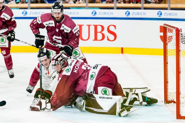 DAVOS, SWITZERLAND - DECEMBER 26: goalkeeper Josef Korenar of Sparta Prague saves on Cory Emmerton of Team Canada during the match between HC Sparta Praha and Team Canada at Hockey Club Davos on December 26, 2022 in Davos, Switzerland. Davos Graubunden Switzerland  Copyright: xJustPictures.ch JarixPestelaccix