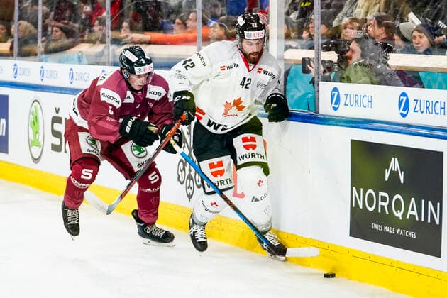 DAVOS, SWITZERLAND - DECEMBER 26: Brendan Perlini of Team Canada against Michael Krutil of Sparta Prague during the match between HC Sparta Praha and Team Canada at Hockey Club Davos on December 26, 2022 in Davos, Switzerland. Davos Graubunden Switzerland Copyright: xJustPictures.ch JarixPestelaccix