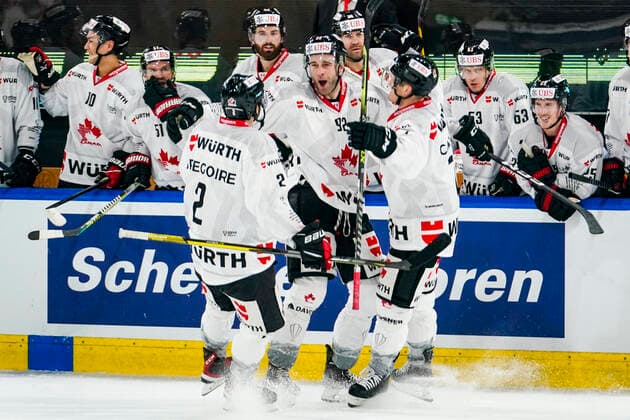 DAVOS, SWITZERLAND - DECEMBER 26: Brett Connolly of Team Canada (C) celebrates his goal with Thomas Gregoire of Team Canada (L) and Daniel Carr of Team Canada (R) during the match between HC Sparta Praha and Team Canada at Hockey Club Davos on December 26, 2022 in Davos, Switzerland. Davos Graubunden Switzerland Copyright: xJustPictures.ch JarixPestelaccix