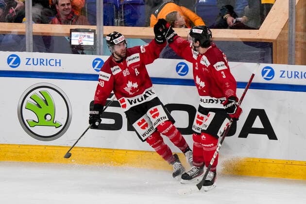 DAVOS, SWITZERLAND - DECEMBER 29: Chris Didomenico of Team Canada (L) celebrates his goal with Josh Brook of Team Canada (R) during the match between Orebro HK and Team Canada at Eisstadion Davos on December 28, 2022 in Davos, Switzerland. Davos Graubunden Switzerland Copyright: xJustPictures.ch JarixPestelaccix