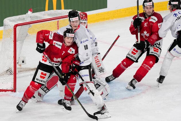 DAVOS, SWITZERLAND - DECEMBER 29: Daniel Carr of Team Canada (L) fight for a position into the slot against Rodrigo Abols of Örebro HK during the match between Orebro HK and Team Canada at Eisstadion Davos on December 28, 2022 in Davos, Switzerland. Davos Graubunden Switzerland Copyright: xJustPictures.ch JarixPestelaccix