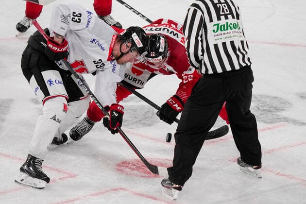 DAVOS, SWITZERLAND - DECEMBER 29: Christopher Mastomki of Örebro HK (L) at the face-off against Alan Quine of Team Canada (C) during the match between Orebro HK and Team Canada at Eisstadion Davos on December 28, 2022 in Davos, Switzerland. Davos Graubunden Switzerland Copyright: xJustPictures.ch JarixPestelaccix